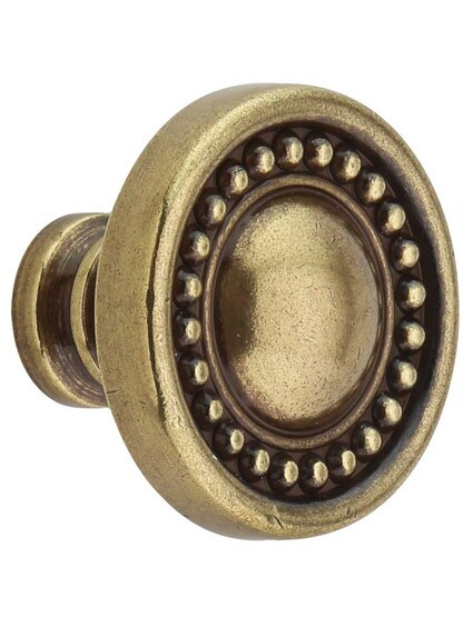 Prestige Cabinet Knob - 1 3/8 inch Diameter in Distressed Antique Brass.